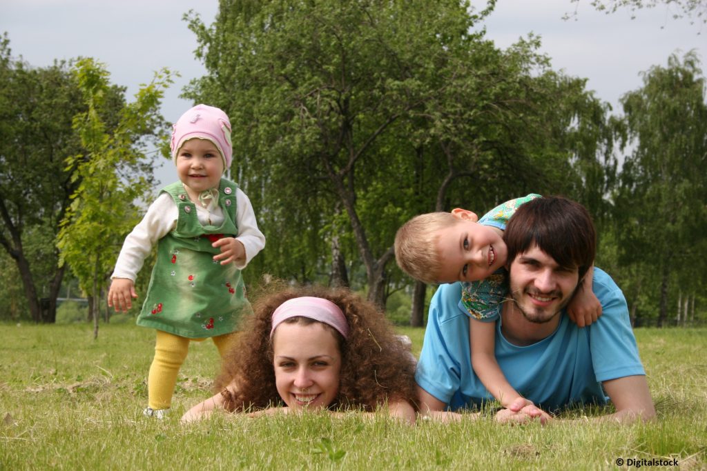family of four on grass